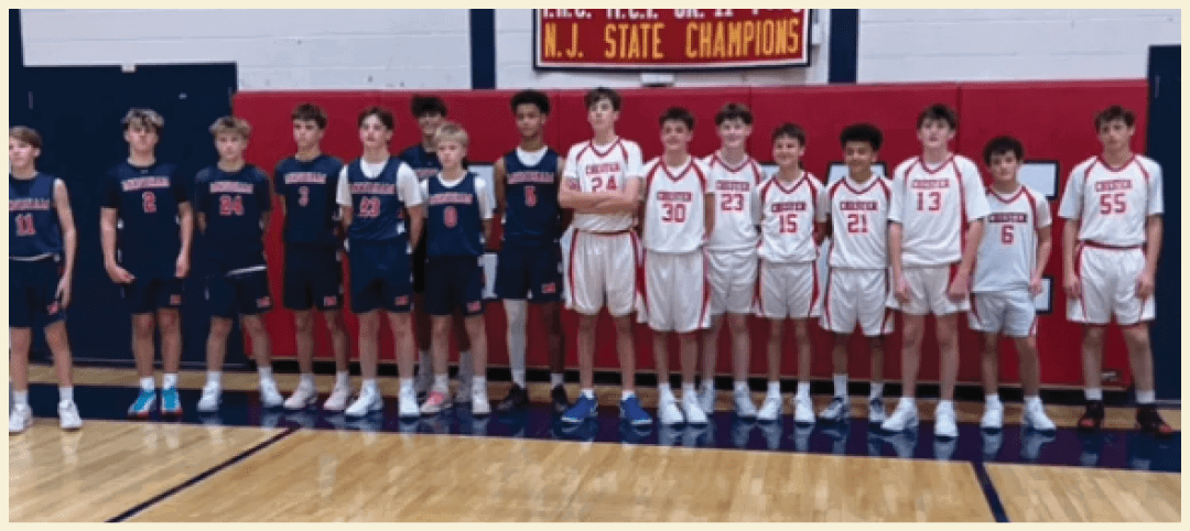 A group of young boys are standing on a basketball court, wearing uniforms and posing for a picture. AI generated content