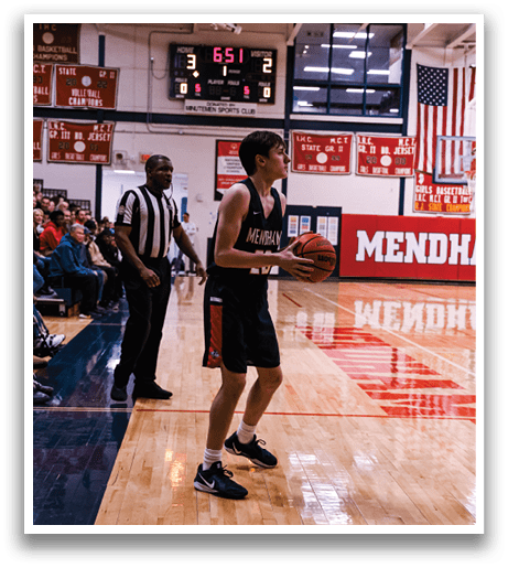 A basketball player is holding a basketball on the court. AI generated content