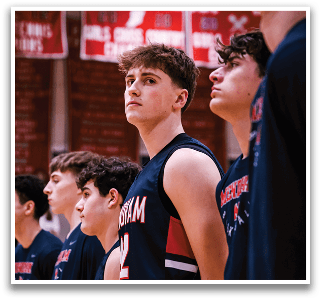 A group of young men wearing basketball uniforms stand on a court. AI generated content