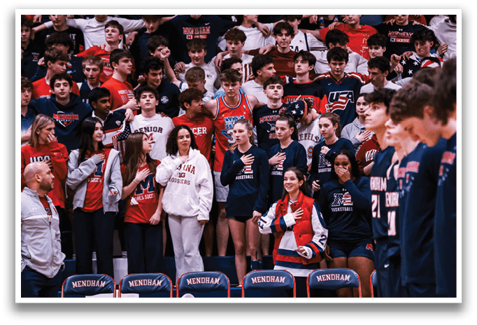 A group of people are sitting in chairs on a basketball court. AI generated content