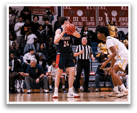 A basketball game is taking place with a man in a blue uniform holding a basketball. AI generated content