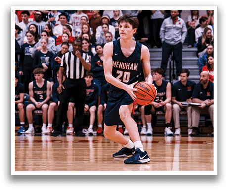 A basketball player in a blue uniform is holding a basketball on the court. AI generated content