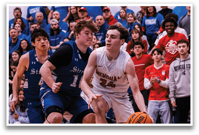 A basketball game is in progress with a group of men playing. One man is holding a basketball while another man is trying to block him. The crowd is watching the game intently. AI generated content