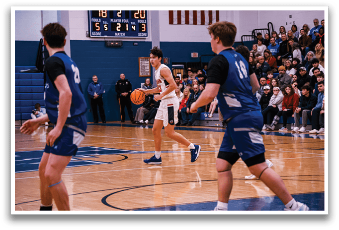 A basketball game is in progress with a player holding the ball. AI generated content