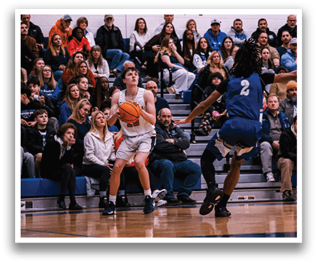 A basketball game is taking place with a player holding the ball. The crowd is watching the game intently. AI generated content