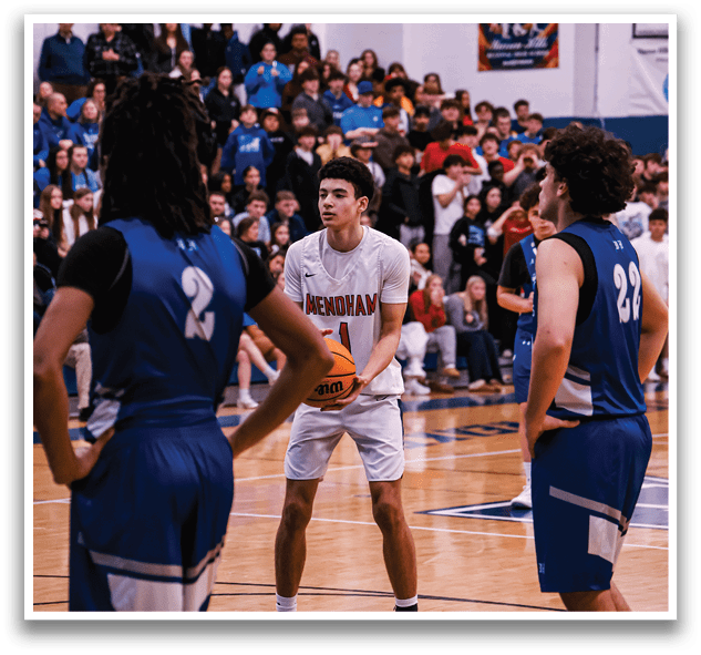 A group of people are playing basketball on a court. One player is holding a basketball while the others watch. AI generated content