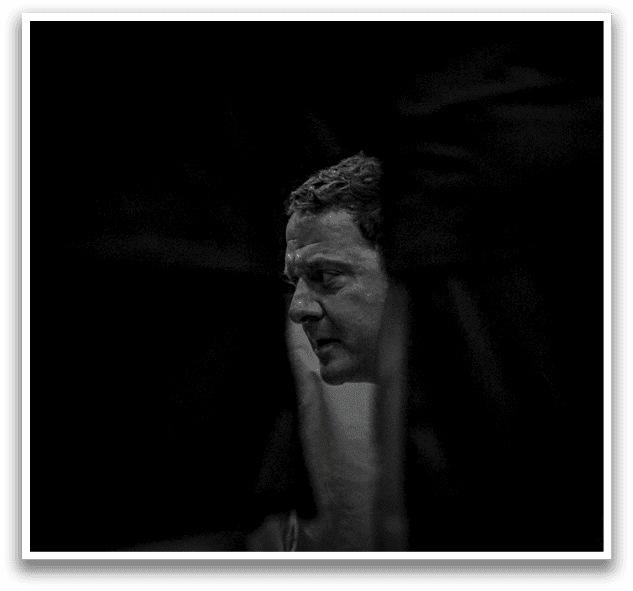 A man is sitting in a chair with his legs crossed. AI generated content