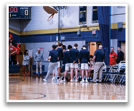 A group of men are standing on a basketball court, some of them wearing blue shirts. AI generated content
