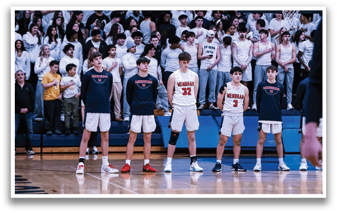 Four young men stand on a basketball court, wearing uniforms and holding basketballs. They are surrounded by a crowd of people who are watching the game. AI generated content