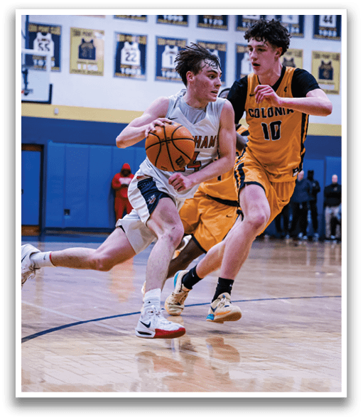 Two basketball players are running on the court, one with a basketball in his hands. AI generated content