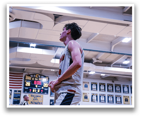 A basketball player is standing on the court with his arms raised, celebrating a point. AI generated content