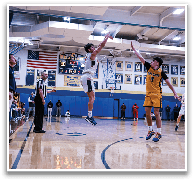 A basketball game is taking place with two teams playing. One player is jumping up to grab the basketball while the other players are watching. The crowd is watching the game intently. AI generated content