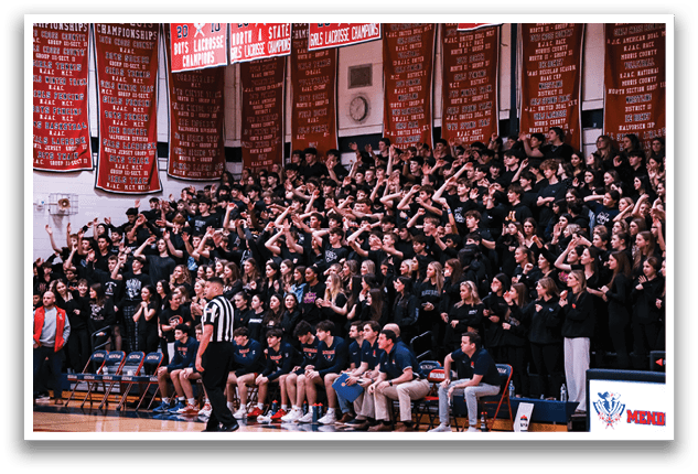 A large crowd of people are sitting in the bleachers, watching a basketball game. The crowd is predominantly female, and they are all wearing black. The spectators are engaged in the game, with some of them clapping and cheering. A referee is also present, overseeing the game. AI generated content
