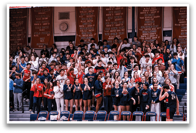A large crowd of people are sitting in the bleachers, watching a game. AI generated content