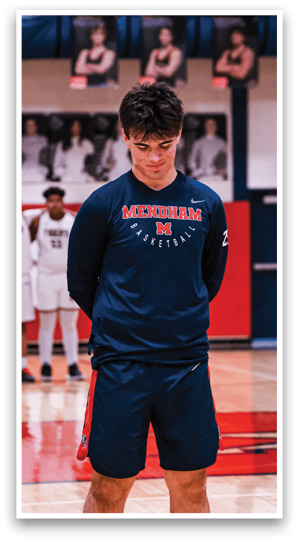 Four young men wearing blue shirts and shorts stand on a basketball court. AI generated content