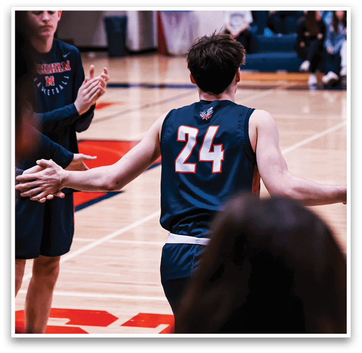 A basketball player wearing the number 24 is walking onto the court. AI generated content