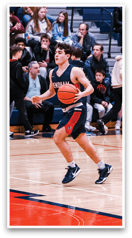 A basketball game is taking place with a group of people playing. A man is running with a basketball in his hand, while others are watching from the sidelines. The spectators are seated on chairs, and there are a few benches in the area. The scene is lively and filled with excitement as the players compete. AI generated content