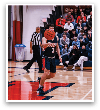 A basketball player is holding a basketball in front of his face while standing on the court. AI generated content