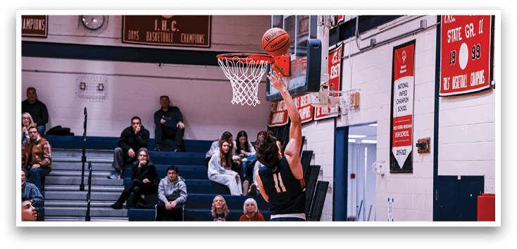 A basketball player is jumping up to hit a basketball in a gym. AI generated content