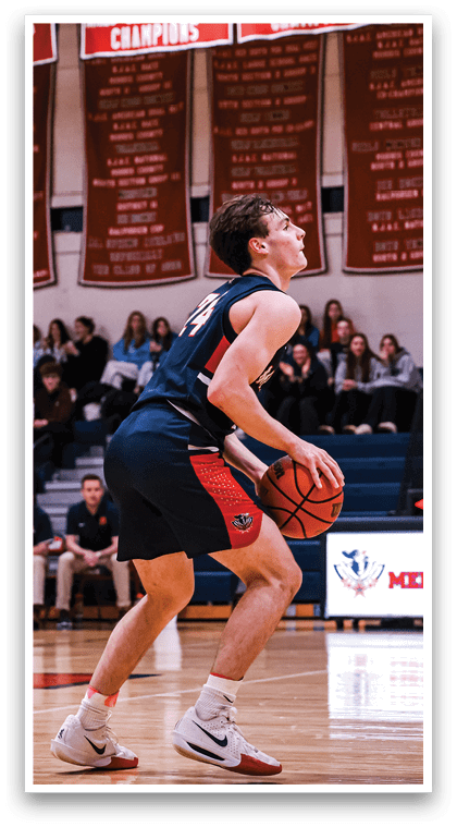 A basketball player in a blue uniform is holding a basketball and looking up at the crowd. AI generated content