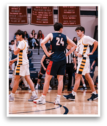 A group of young men playing basketball on a court. AI generated content