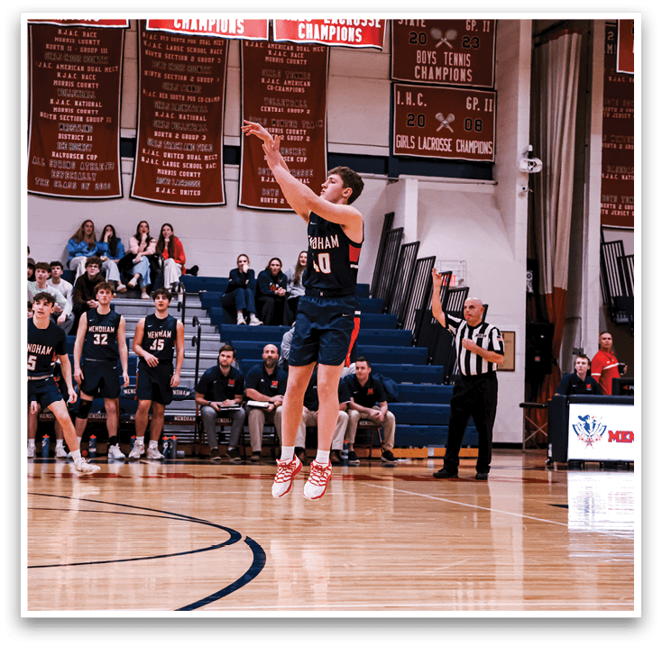 A basketball player is jumping to shoot the ball, while a referee watches closely. The game is being played in front of a crowd of spectators. AI generated content