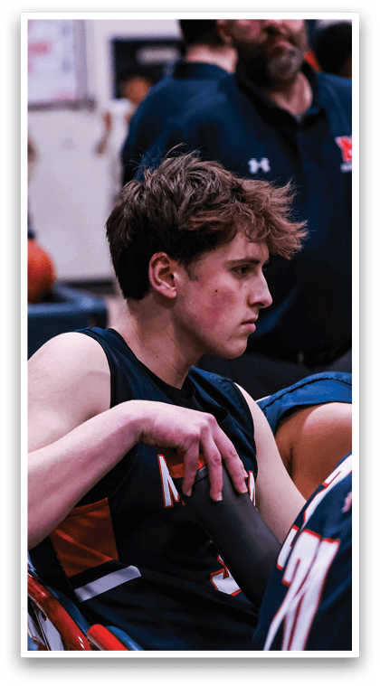 A group of young men are sitting on chairs in a gym. AI generated content