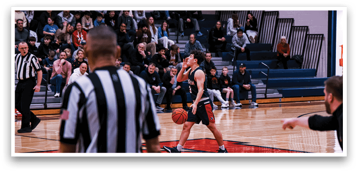 A basketball player shoots a free throw in front of a crowd of spectators. AI generated content
