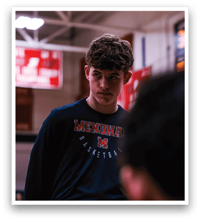 A man wearing a blue shirt with the word Mississippi on it stands in a gym. AI generated content