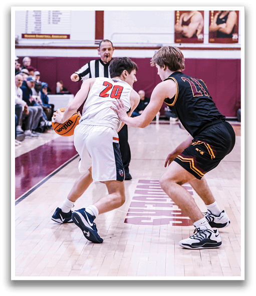 Two basketball players are on the court, one wearing a red jersey and the other wearing a black jersey. The red jersey player is holding a basketball. AI generated content