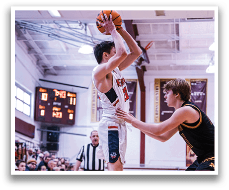 Two basketball players are playing on a court, one is jumping to shoot the ball while the other is trying to block the shot. AI generated content
