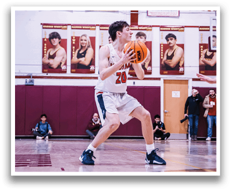 A basketball player in a white jersey is holding a basketball, ready to shoot. AI generated content
