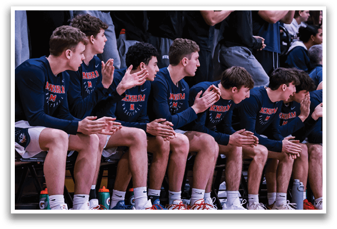 A group of young men are sitting on a bench in a gym, clapping for their teammates. AI generated content