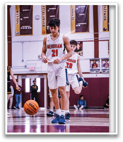 A basketball game is in progress with players on the court. One player is holding the ball, while another player is running towards him. The players are wearing uniforms and are actively engaged in the game. AI generated content