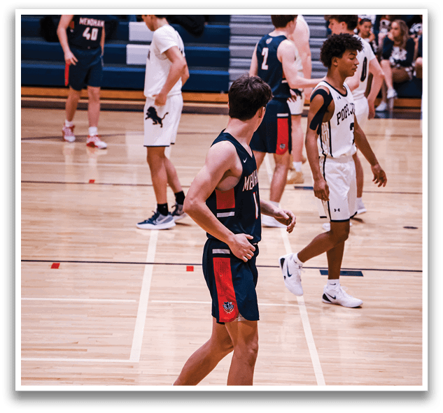 A group of young men are playing basketball on a court. AI generated content