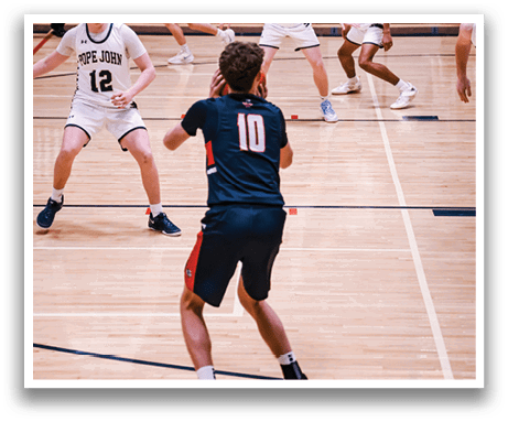 A group of young men playing basketball on a court. AI generated content