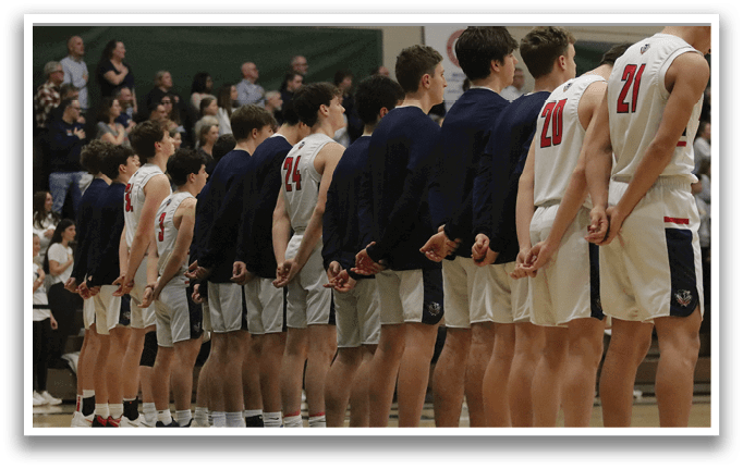 A group of young men wearing blue and white uniforms stand in a line on a basketball court. AI generated content