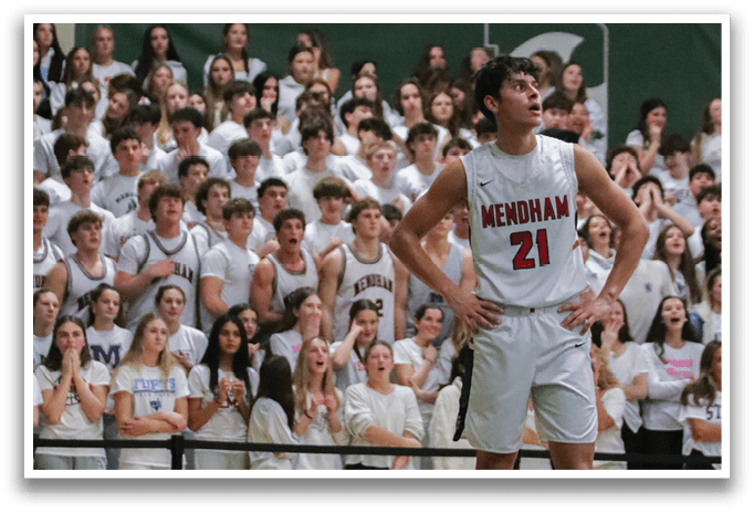A basketball player wearing a white jersey with the number 22 stands on the court, surrounded by a crowd of people. AI generated content
