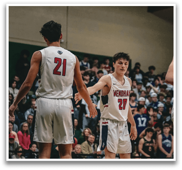 Two basketball players wearing number 21 and 22 walk on the court. AI generated content