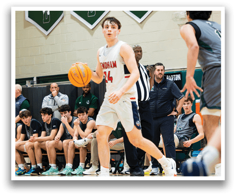 A basketball player wearing a red jersey with the number 14 on it is holding a basketball and running down the court. AI generated content
