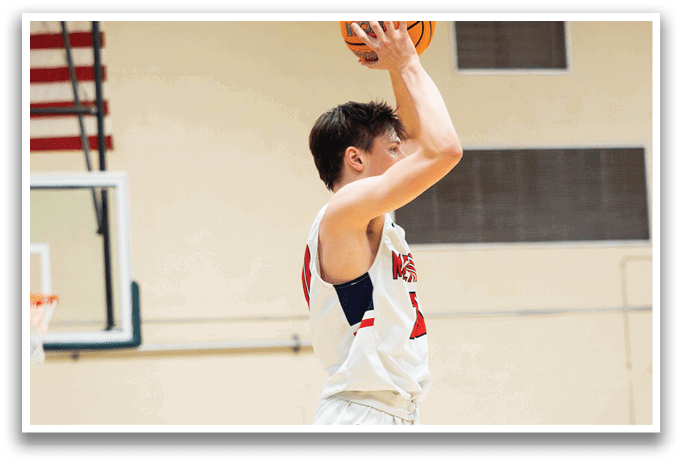 A man in a white and red basketball uniform is reaching up to catch a basketball. AI generated content