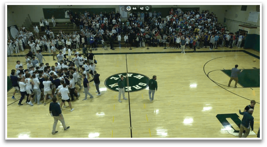 A group of people are playing a game of basketball in a gym. AI generated content