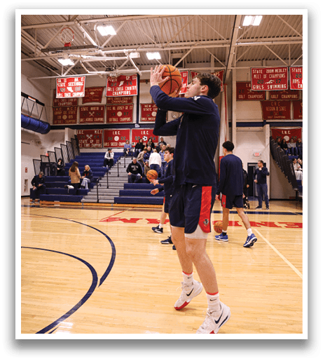 A basketball player in a blue and orange uniform shoots a basket during a game. AI generated content