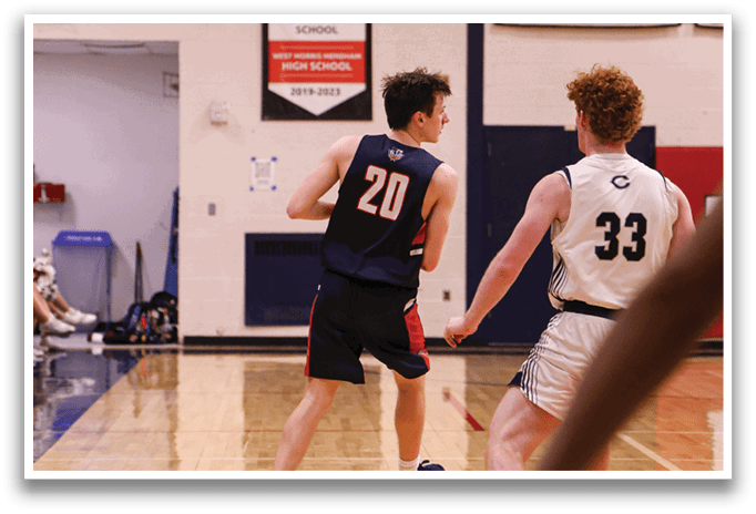 Two basketball players on a court, one with the number 20 on his jersey. AI generated content