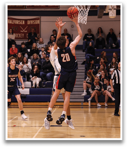 A basketball player jumps to block a shot, while the crowd watches. AI generated content
