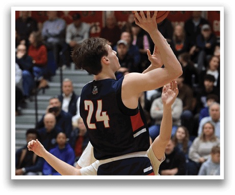 A basketball player in a blue uniform jumps to shoot the ball. AI generated content