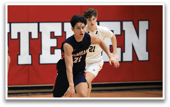 Two basketball players on a court, one holding a ball and the other running towards him. AI generated content