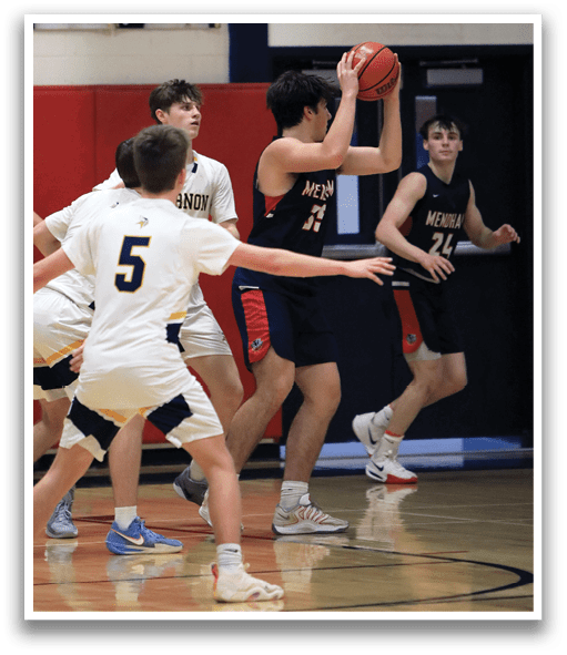 A group of young men playing basketball on a court. AI generated content