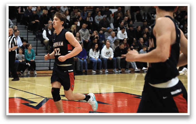 A basketball player wearing a number 12 jersey is running down the court. AI generated content