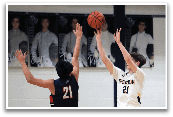 Two basketball players are jumping for the ball, one wearing a blue uniform and the other wearing a white uniform. AI generated content